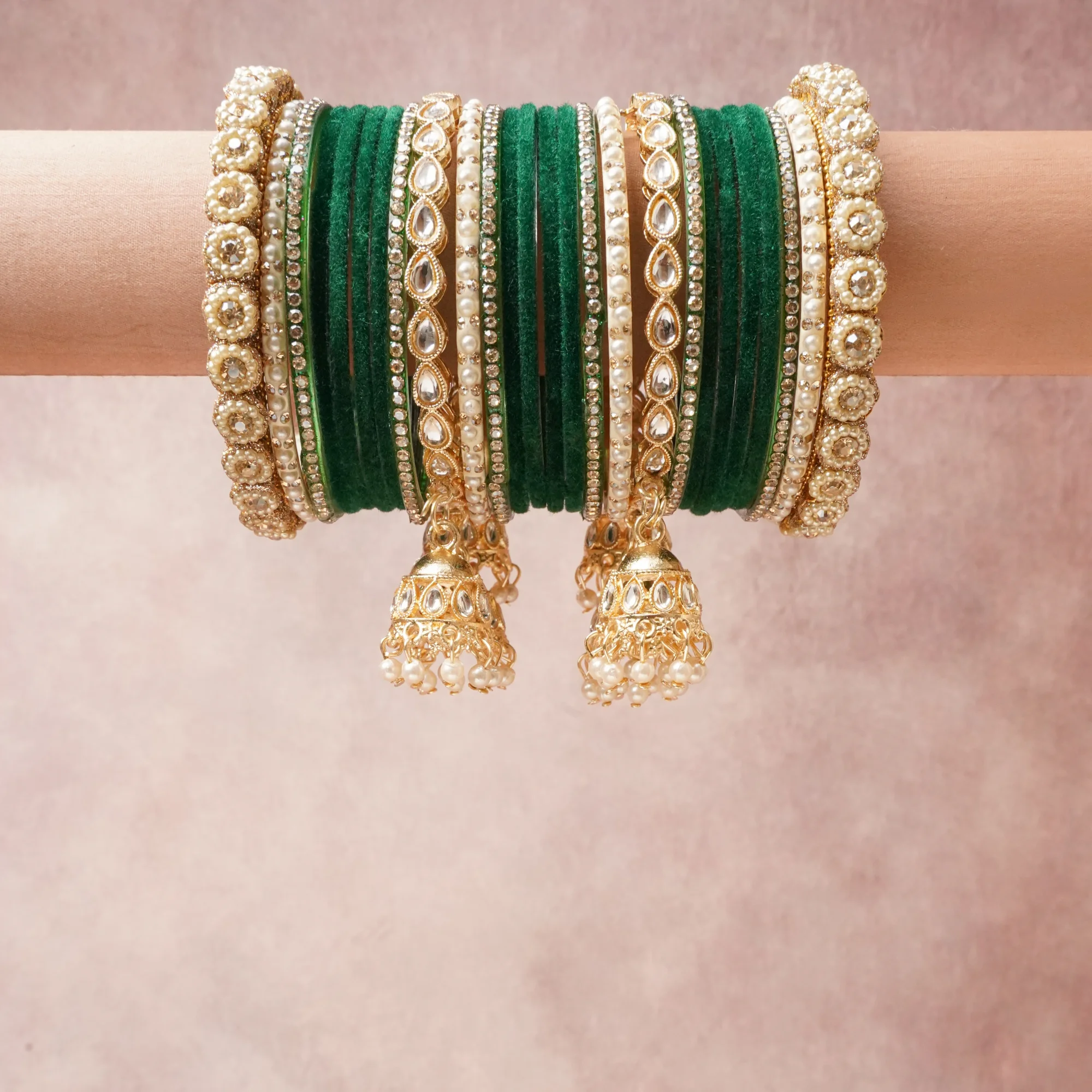 A commanding Deep Emerald Green anchors this beautiful set, enriched with accents of Antique Gold, Cream, Clear that add depth and dimension.

Featuring a striking composition of Velvet, Gold-toned Alloy, Faux Pearls, Polki Simulants, Glass Rhinestones, this set carries intricate craftsmanship and strong presence. Grand in form, it is created for moments that deserve to be marked.